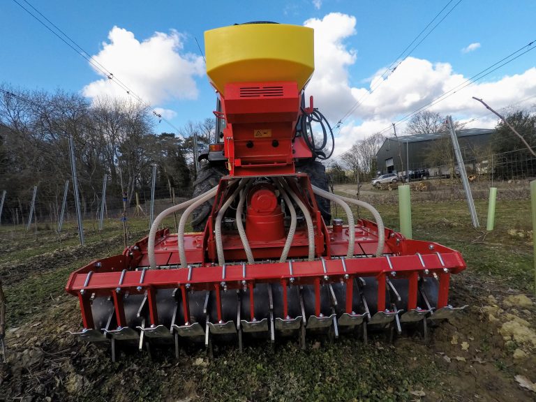 Power harrow-seed drill combination machine in a UK vineyard