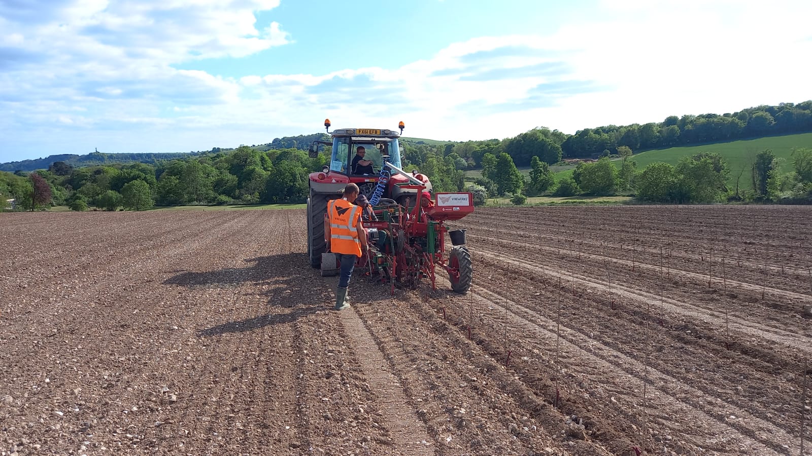 VineWorks crew with planting machine  planting a new vineyard in UK