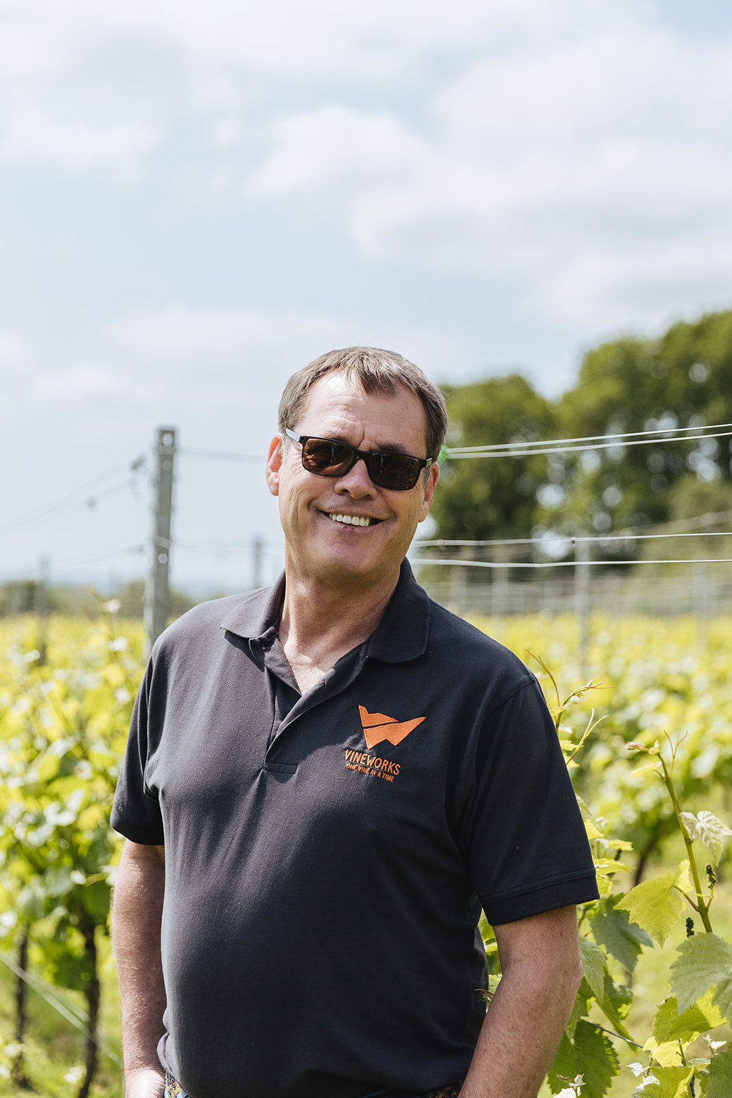 VineWorks Viticulturist, Charles Martin, standing in a UK vineyard. 