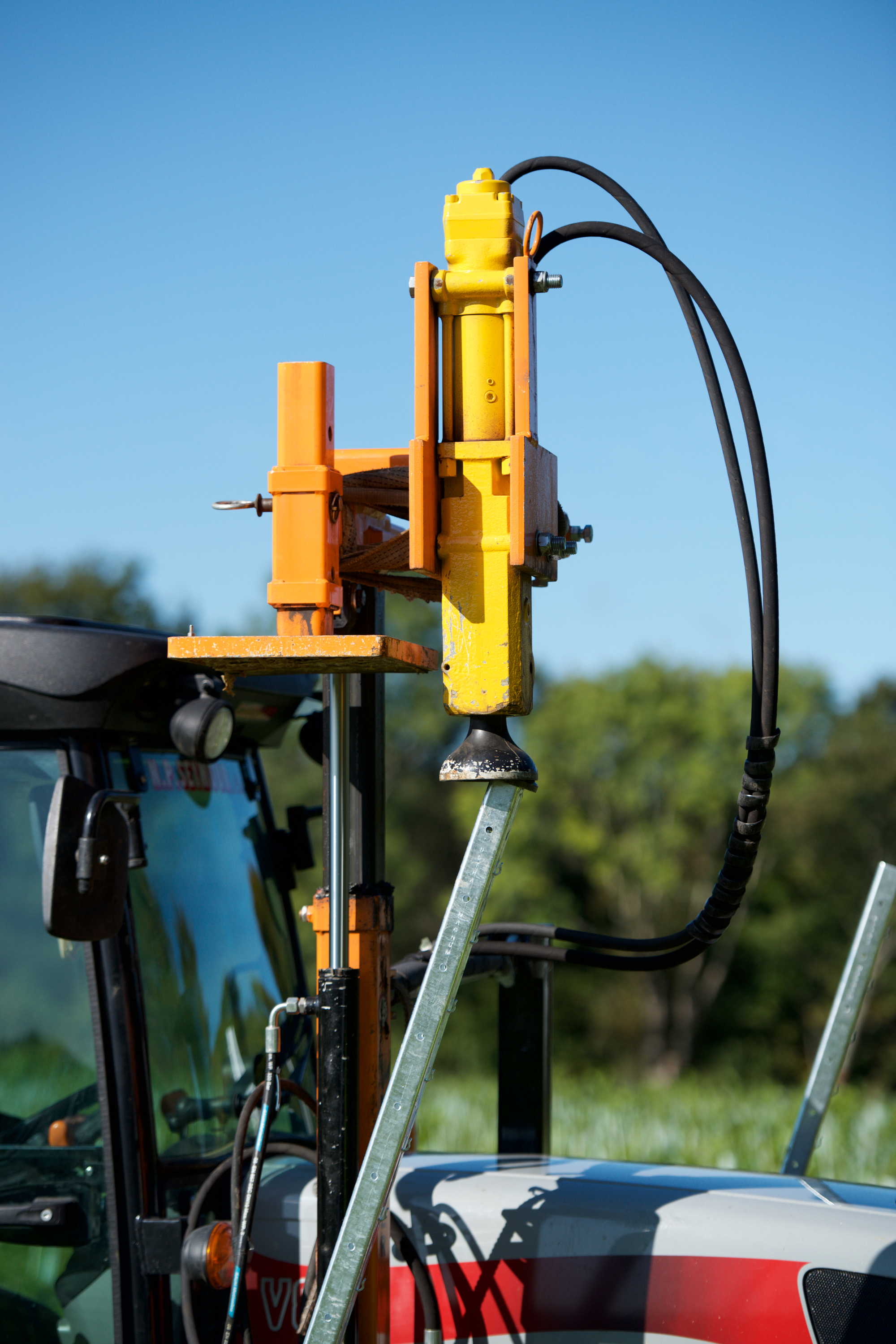 Tractor-Mounted Rammer Installing Hadley End Post in Vineyard